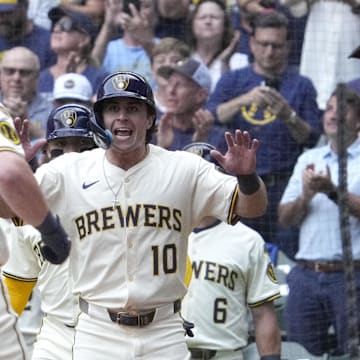 Andrew Vaughn is greeted by Sal Frelick (10) after hitting a home run vs. the Dodgers