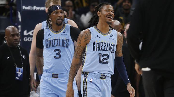 Jan 21, 2026; Memphis, Tennessee, USA; Memphis Grizzlies guard Ja Morant (12) reacts after having to be separated from Atlanta Hawks forward Mouhamed Gueye (18) after an altercation during the second quarter at FedExForum. Mandatory Credit: Petre Thomas-Imagn Images