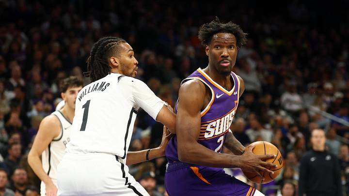 Jan 27, 2026; Phoenix, Arizona, USA; Phoenix Suns forward Nigel Hayes-Davis (21) drives to the basket against Brooklyn Nets forward Ziaire Williams (1) in the first half at Mortgage Matchup Center. Mandatory Credit: Mark J. Rebilas-Imagn Images