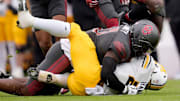 Oklahoma Sooners linebacker Kobie McKinzie (11) brings down Missouri Tigers running back Ahmad Hardy (29) during a college football game between the University of Oklahoma Sooners (OU) and the Missouri Tigers at Gaylord Family — Oklahoma Memorial Stadium in Norman on Saturday.