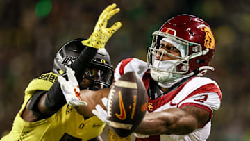 Oregon Ducks defensive back Jahlil Florence (6) blocks a pass intended for USC Trojans wide receiver Brenden Rice (2) during the first half of the game on Saturday, Nov. 11, 2023, at Autzen Stadium in Eugene, Ore.