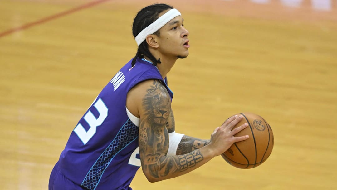 Dec 22, 2025; Cleveland, Ohio, USA; Charlotte Hornets guard Tre Mann (23) shoots in the third quarter against the Cleveland Cavaliers at Rocket Arena. Mandatory Credit: David Richard-Imagn Images