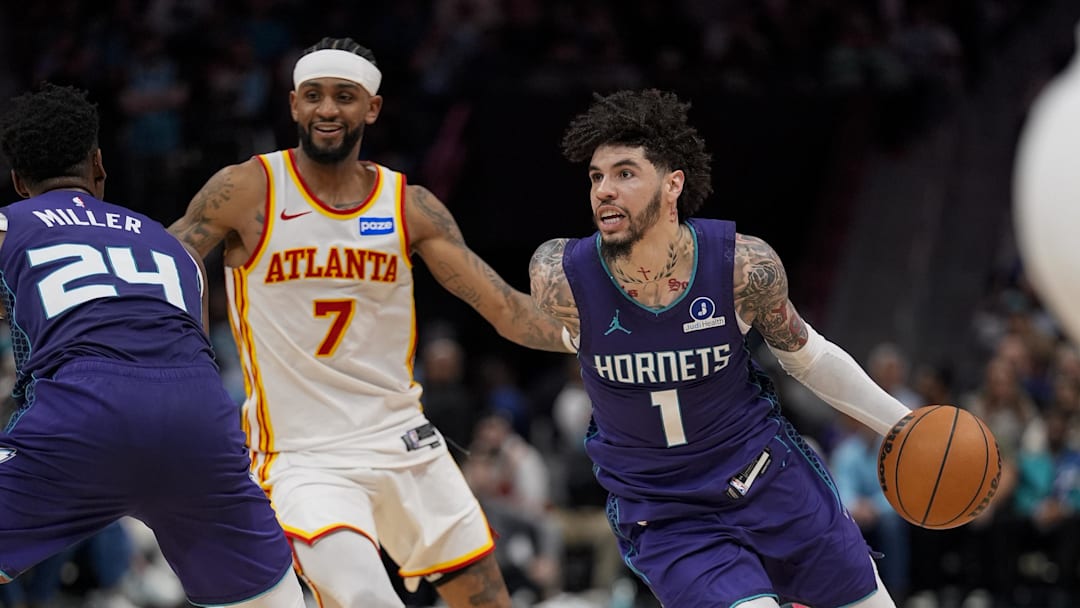 Charlotte Hornets guard LaMelo Ball (1) goes to the basket past Atlanta Hawks guard Nickeil Alexander-Walker
