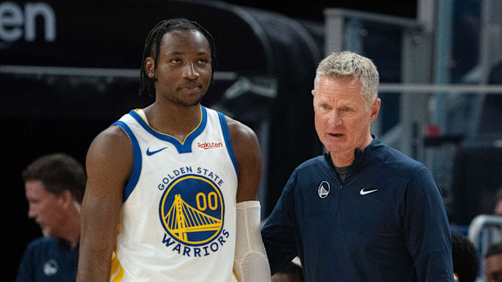 October 20, 2023; San Francisco, California, USA; Golden State Warriors head coach Steve Kerr (right) talks to forward Jonathan Kuminga (00) during the third quarter against the San Antonio Spurs at Chase Center. Mandatory Credit: Kyle Terada-Imagn Images