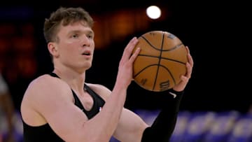 Apr 4, 2025; Los Angeles, California, USA;  Los Angeles Lakers guard Dalton Knecht (4) warms up prior to the game against the New Orleans Pelicans at Crypto.com Arena. Mandatory Credit: Jayne Kamin-Oncea-Imagn Images
