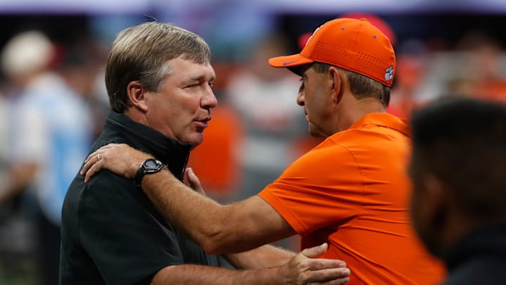 Georgia coach Kirby Smart and Clemson head coach Dabo Swinney speak before the start of the NCAA Aflac Kickoff Game in Atlanta, on Saturday, Aug. 31, 2024.