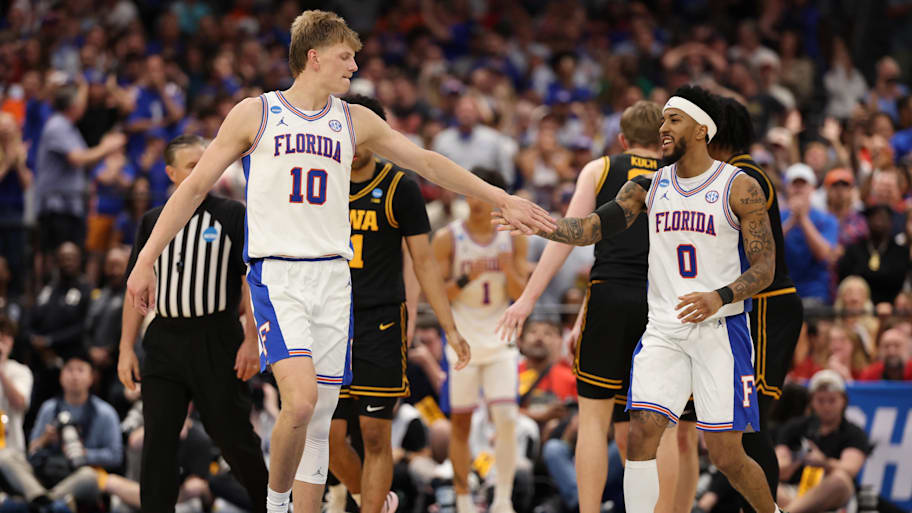 Florida Gators forward Thomas Haugh high-fives Florida Gators guard Boogie Fland during the NCAA tournament.