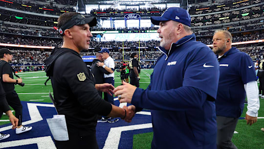 Sep 15, 2024; Arlington, Texas, USA;  New Orleans Saints head coach Dennis Allen (left) greets Dallas Cowboys head coach Mike McCarthy after the game at AT&T Stadium. 