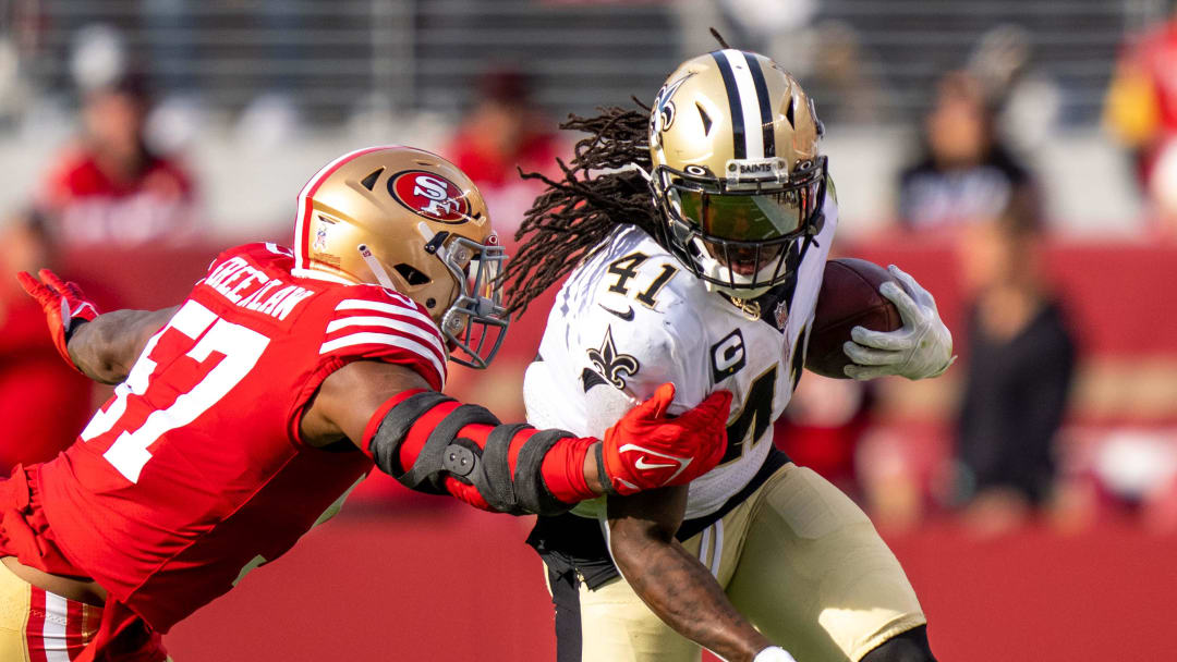 November 27, 2022; Santa Clara, California, USA; New Orleans Saints running back Alvin Kamara (41) runs the football against San Francisco 49ers linebacker Dre Greenlaw (57) during the second quarter at Levi's Stadium. Mandatory Credit: Kyle Terada-USA TODAY Sports