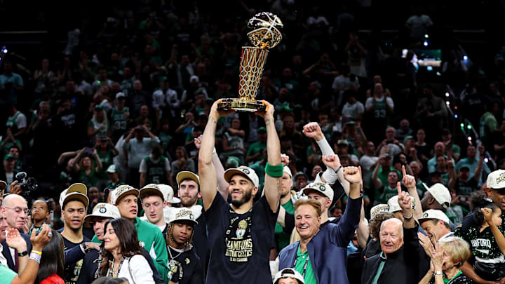 Boston Celtics forward Jayson Tatum celebrates with the Larry O’Brian Trophy after winning the 2024 NBA Finals