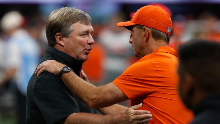 Georgia coach Kirby Smart and Clemson head coach Dabo Swinney speak before the start of the NCAA Aflac Kickoff Game in Atlanta, on Saturday, Aug. 31, 2024.