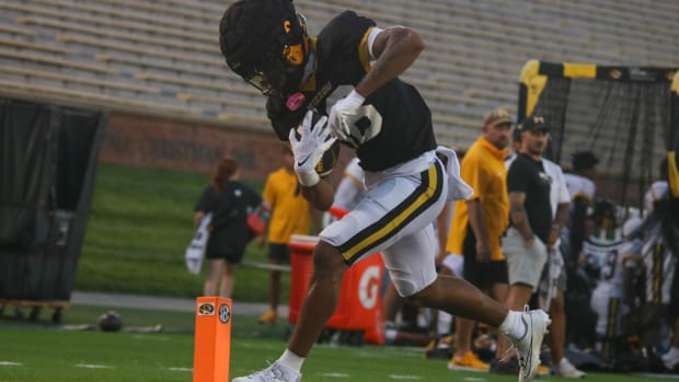 Missouri Tigers wide receiver Daniel Blood (16) crosses over the goal line at the team's annual fan night practice.