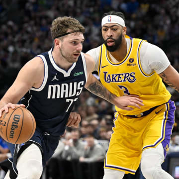 Dec 12, 2023; Dallas, Texas, USA; Dallas Mavericks guard Luka Doncic (77) and Los Angeles Lakers forward Anthony Davis (3) in action during the game between the Dallas Mavericks and the Los Angeles Lakers at the American Airlines Center. Mandatory Credit: Jerome Miron-USA TODAY Sports