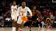 Cincinnati Bearcats guard Day Day Thomas (1) takes the ball down court in the second half of the NCAA basketball game against the Grambling State Tigers at Fifth Third Arena in Cincinnati on Sunday, Dec. 22, 2024.