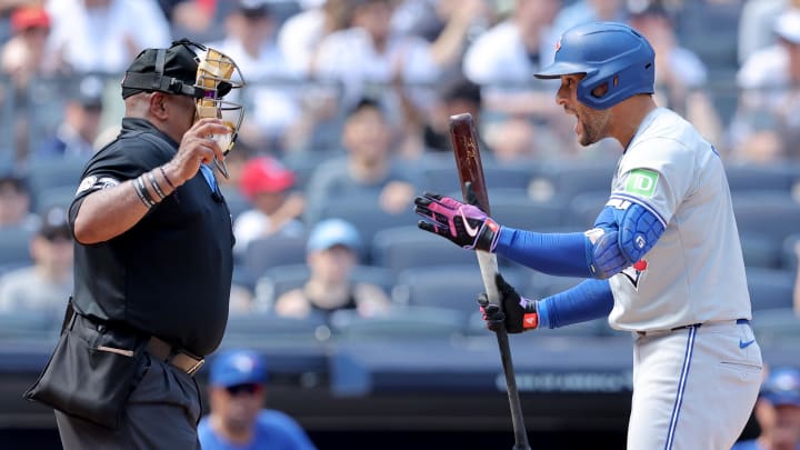 Toronto Blue Jay George Springer yells at the home plate umpire after striking out.