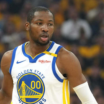 Apr 26, 2025; San Francisco, California, USA; Golden State Warriors forward Jonathan Kuminga (00) handles the ball against the Houston Rockets during the first quarter of game three of first round for the 2024 NBA Playoffs at Chase Center. Mandatory Credit: Darren Yamashita-Imagn Images