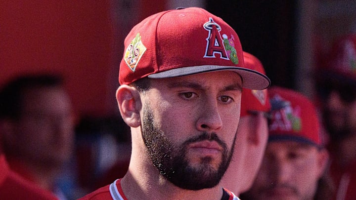 Feb 24, 2026; Tempe, Arizona, USA; Los Angeles Angels pitcher Grayson Rodriguez (21) reacts in the dugout with his team after being relieved in the second inning against the San Francisco Giants during a spring training game at Tempe Diablo Stadium. Mandatory Credit: Allan Henry-Imagn Images