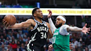 Nov 10, 2025; Dallas, Texas, USA;  Milwaukee Bucks forward Giannis Antetokounmpo (34) looks to pass around Dallas Mavericks forward Daniel Gafford (21) during the first quarter at American Airlines Center. Mandatory Credit: Kevin Jairaj-Imagn Images