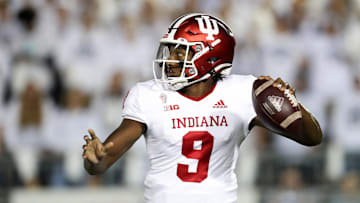 Oct 2, 2021; University Park, Pennsylvania, USA; Indiana Hoosiers quarterback Michael Penix Jr. (9) drops back to throw a pass against the Penn State Nittany Lions during the first quarter at Beaver Stadium. Mandatory Credit: Matthew OHaren-Imagn Images
