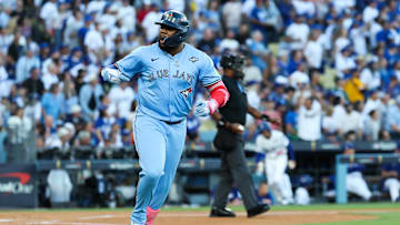 Oct 29, 2025; Los Angeles, California, USA; Toronto Blue Jays first baseman Vladimir Guerrero Jr. (27) celebrates after hitting a solo home run during the first inning against the Los Angeles Dodgers during game five of the 2025 MLB World Series at Dodger Stadium. Mandatory Credit: Kiyoshi Mio-Imagn Images