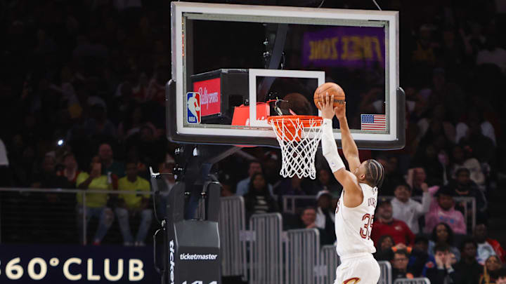 Mar 6, 2024; Atlanta, Georgia, USA; Cleveland Cavaliers forward Isaac Okoro (35) dunks after stealing the ball from Atlanta Hawks forward De'Andre Hunter (12) in the second half at State Farm Arena. Mandatory Credit: Brett Davis-Imagn Images
