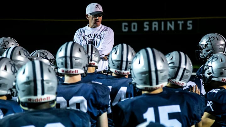 Cedar Rapids Xavier head coach Duane Schulte talks with players after a Class 4A varsity football game against Clear Creek Amana, Friday, Oct. 8, 2021, at Saints Field in Cedar Rapids, Iowa. Cedar Rapids Xavier head coach Duane Schulte talks with players after a Class 4A varsity football game against Clear Creek Amana, Friday, Oct. 8, 2021, at Saints Field in Cedar Rapids, Iowa.