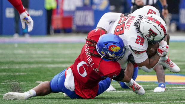 Nov 11, 2023; Lawrence, Kansas, USA; Kansas Jayhawks linebacker Taiwan Berryhill Jr. (6) tackles Texas Tech Red Raid