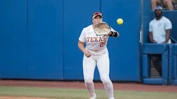 Jun 6, 2024; Oklahoma City, OK, USA;  Texas Longhorns first baseman Katie Stewart (20) catches the ball for an out in the second inning against the Oklahoma Sooners during game two of the Women's College World Series softball championship finals at Devon Park. Mandatory Credit: Brett Rojo-Imagn Images