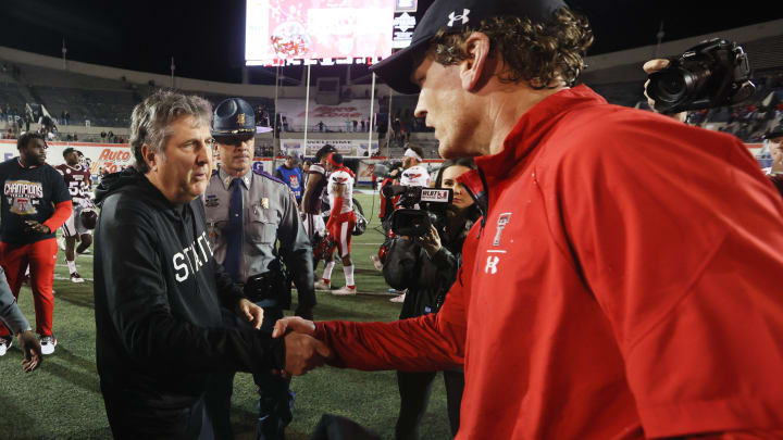 Texas Tech Red Raiders Head Coach Sonny Cumbie shakes the hand of Mississippi State Bulldogs Head Coach Mike Leach after Tech's 34-7 win at the AutoZone Liberty Bowl at Liberty Bowl Memorial Stadium on Tuesday, Dec. 28, 2021.