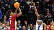 Mar 29, 2025; Newark, NJ, USA; Alabama Crimson Tide guard Labaron Philon (0) shoots the ball against Duke Blue Devils guard Sion James (14) during the second half in the East Regional final of the 2025 NCAA tournament at Prudential Center. Mandatory Credit: Robert Deutsch-Imagn Images