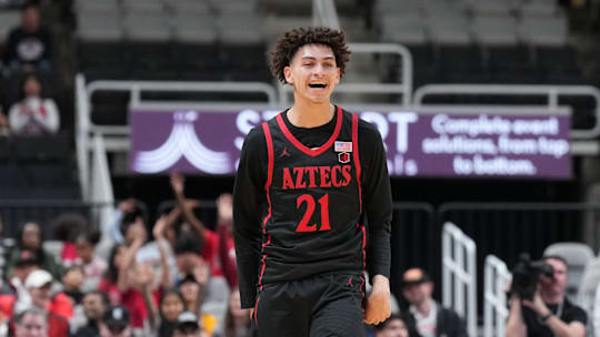 Dec 21, 2024; San Jose, California, USA; San Diego State Aztecs guard Miles Byrd (21) reacts after making a three point basket against the California Golden Bears during the first half at SAP Center. Mandatory Credit: Darren Yamashita-Imagn Images