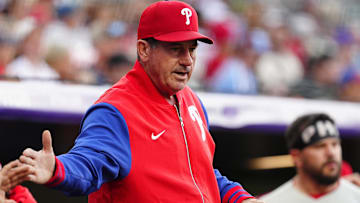  Philadelphia Phillies manager Rob Thomson (59) celebrates a run scored in the first inning against the Colorado Rockies at Coors Field.