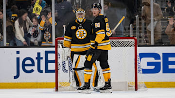 Dec 1, 2024; Boston, Massachusetts, USA; Boston Bruins goaltender Jeremy Swayman (1) and defenseman Nikita Zadorov (91) celebrate a win against the Montreal Canadiens at TD Garden. Mandatory Credit: Natalie Reid-Imagn Images
