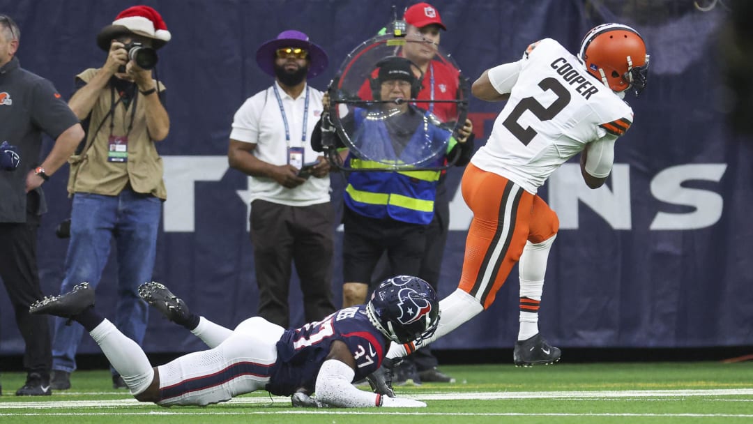 Dec 24, 2023; Houston, Texas, USA; Cleveland Browns wide receiver Amari Cooper (2) makes a reception and scores a touchdown as Houston Texans cornerback D'Angelo Ross (37) defends during the second quarter at NRG Stadium. Mandatory Credit: Troy Taormina-USA TODAY Sports