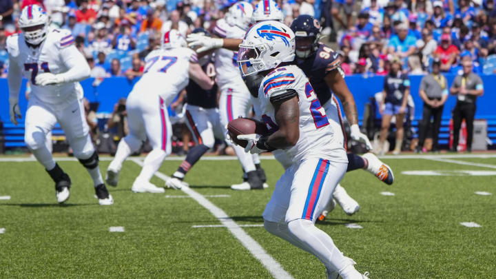 Aug 10, 2024; Orchard Park, New York, USA; Buffalo Bills running back Ray Davis (22) runs with the ball after making a catch against the Chicago Bears during the first half at Highmark Stadium.  