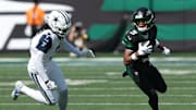 Oct 5, 2025; East Rutherford, New Jersey, USA; New York Jets wide receiver Garrett Wilson (5) turns up field after the catch as Dallas Cowboys cornerback Trevon Diggs (7) defends during the first half at MetLife Stadium. Mandatory Credit: Vincent Carchietta-Imagn Images
