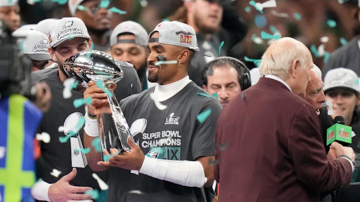 Feb 9, 2025; New Orleans, LA, USA; Philadelphia Eagles quarterback Jalen Hurts (1) hoists the Vince Lombardi Trophy after defeating the Kansas City Chiefs in Super Bowl LIX at Ceasars Superdome. Mandatory Credit: Kirby Lee-Imagn Images Feb 9, 2025; New Orleans, LA, USA; Philadelphia Eagles quarterback Jalen Hurts (1) hoists the Vince Lombardi Trophy after defeating the Kansas City Chiefs in Super Bowl LIX at Ceasars Superdome. Mandatory Credit: Kirby Lee-Imagn Images