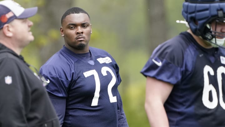 Kiran Amegadjie watches Bears minicamp from the sideline. Amegadjie, a third-round rookie from Yale, will be available to practice for the first time this week.