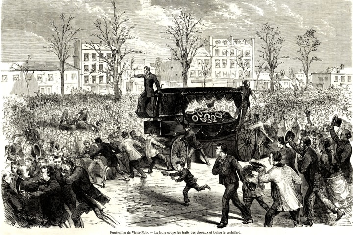 packed crowds surround a horse-drawn hearse