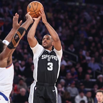 Dec 25, 2024; New York, New York, USA;  San Antonio Spurs guard Chris Paul (3) shoots over New York Knicks forward OG Anunoby (8) in the first quarter at Madison Square Garden. Mandatory Credit: Wendell Cruz-Imagn Images
