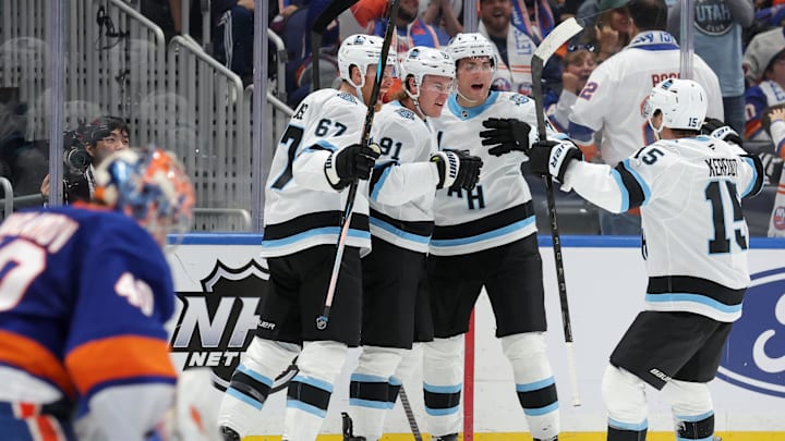 Oct 10, 2024; Elmont, New York, USA; Utah Hockey Club right wing Josh Doan (91) celebrates his goal against New York Islanders goaltender Semyon Varlamov (40) with teammates during the third period at UBS Arena. Mandatory Credit: Brad Penner-Imagn Images Oct 10, 2024; Elmont, New York, USA; Utah Hockey Club right wing Josh Doan (91) celebrates his goal against New York Islanders goaltender Semyon Varlamov (40) with teammates during the third period at UBS Arena. Mandatory Credit: Brad Penner-Imagn Images