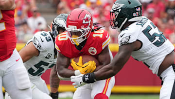 Sep 14, 2025; Kansas City, Missouri, USA; Philadelphia Eagles defensive end Za'Darius Smith (52) tackles Kansas City Chiefs running back Isiah Pacheco (10) during the second quarter of the game at GEHA Field at Arrowhead Stadium. Mandatory Credit: Denny Medley-Imagn Images