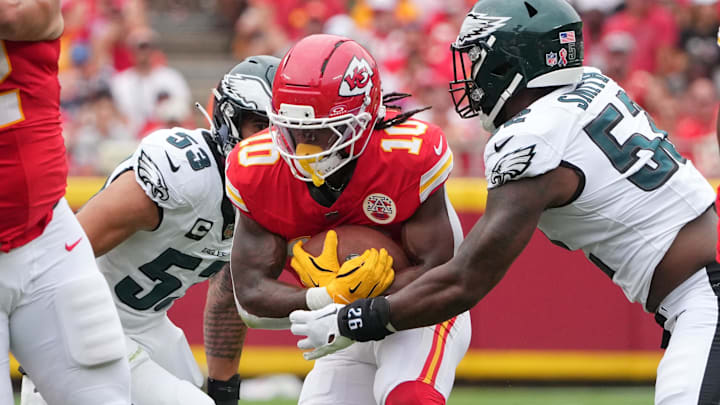 Sep 14, 2025; Kansas City, Missouri, USA; Philadelphia Eagles defensive end Za'Darius Smith (52) tackles Kansas City Chiefs running back Isiah Pacheco (10) during the second quarter of the game at GEHA Field at Arrowhead Stadium. Mandatory Credit: Denny Medley-Imagn Images