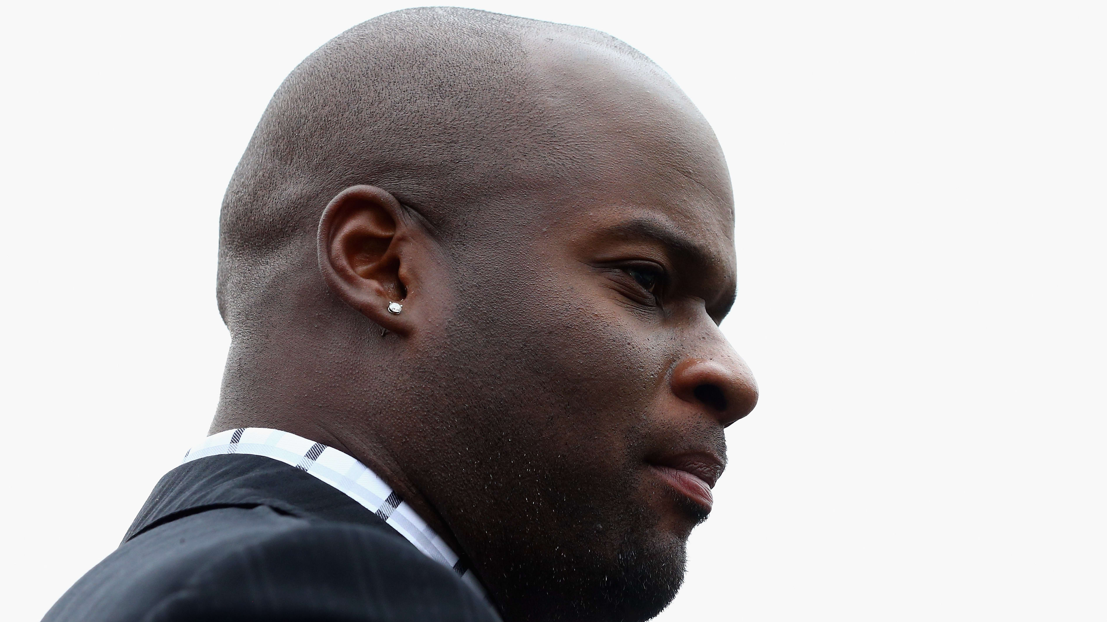 Former Texas Longhorns quarterback Vince Young on the sideline during a college football game.