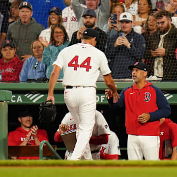 Aug 29, 2024; Boston, Massachusetts, USA; Boston Red Sox relief pitcher Rich Hill (44) is congratulated by manager Alex Cora (13) after ending the eighth inning with a strikeout against the Toronto Blue Jays at Fenway Park. Mandatory Credit: David Butler II-Imagn Images