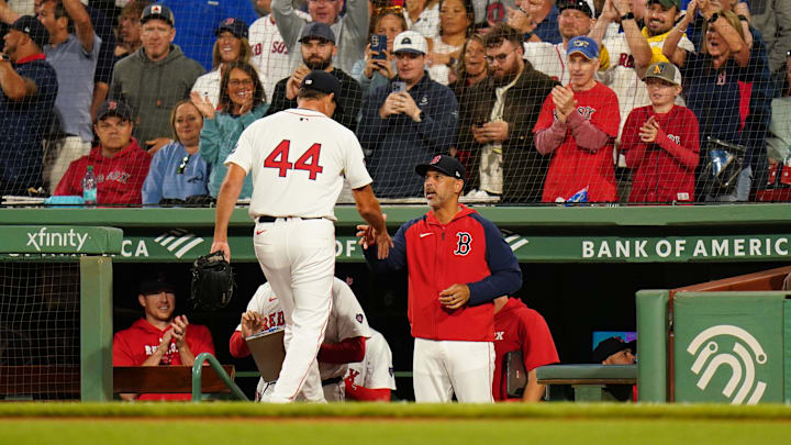 Aug 29, 2024; Boston, Massachusetts, USA; Boston Red Sox relief pitcher Rich Hill (44) is congratulated by manager Alex Cora (13) after ending the eighth inning with a strikeout against the Toronto Blue Jays at Fenway Park. Mandatory Credit: David Butler II-Imagn Images