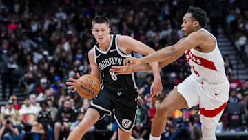 Oct 17, 2025; Toronto, Ontario, CAN; Brooklyn Nets guard Egor Dëmin (8) dribbles the ball against Toronto Raptors forward/guard Scottie Barnes (4) during the second quarter at Scotiabank Arena. Mandatory Credit: Kevin Sousa-Imagn Images