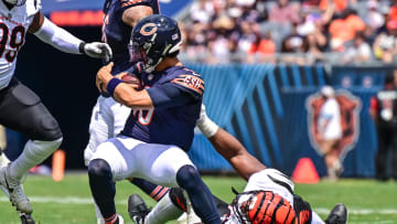 Aug 17, 2024; Chicago, Illinois, USA; Chicago Bears quarterback Caleb Williams (18) is sacked by Cincinnati Bengals defensive tackle Kris Jenkins (90) during the second quarter at Soldier Field. Mandatory Credit: Daniel Bartel-USA TODAY Sports