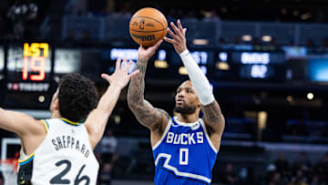 Mar 11, 2025; Indianapolis, Indiana, USA; Milwaukee Bucks guard Damian Lillard (0) shoots the ball while Indiana Pacers guard Ben Sheppard (26) defends in the second half  at Gainbridge Fieldhouse. Mandatory Credit: Trevor Ruszkowski-Imagn Images