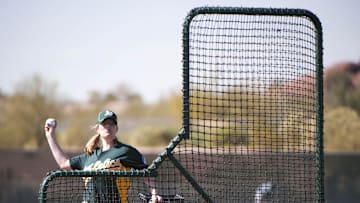 February 23, 2011; Phoenix, AZ, USA; Justine Siegal pitches batting practice during spring training for the Oakland Athletics at Papago Park Baseball Complex.